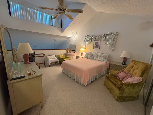 a bedroom with bed and window