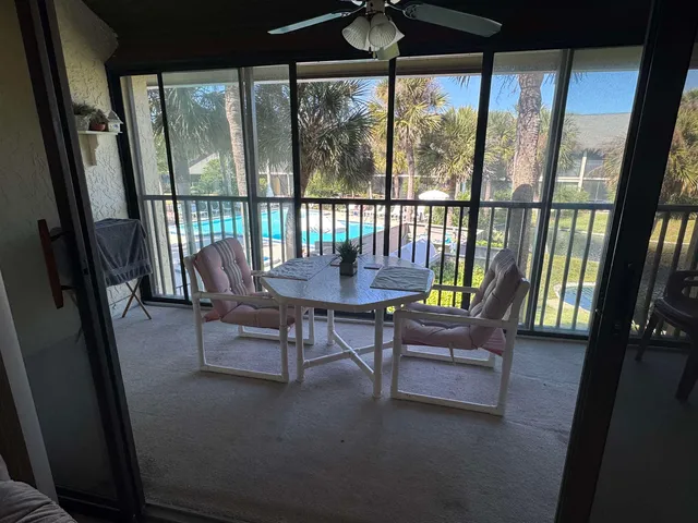 a view of a porch with furniture