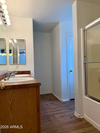 a view of a sink and a refrigerator