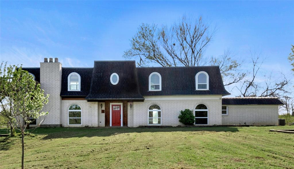 41 Kelsey Road Denison, TX 75021 - Photo 2 of 31 a front view of a house with a yard