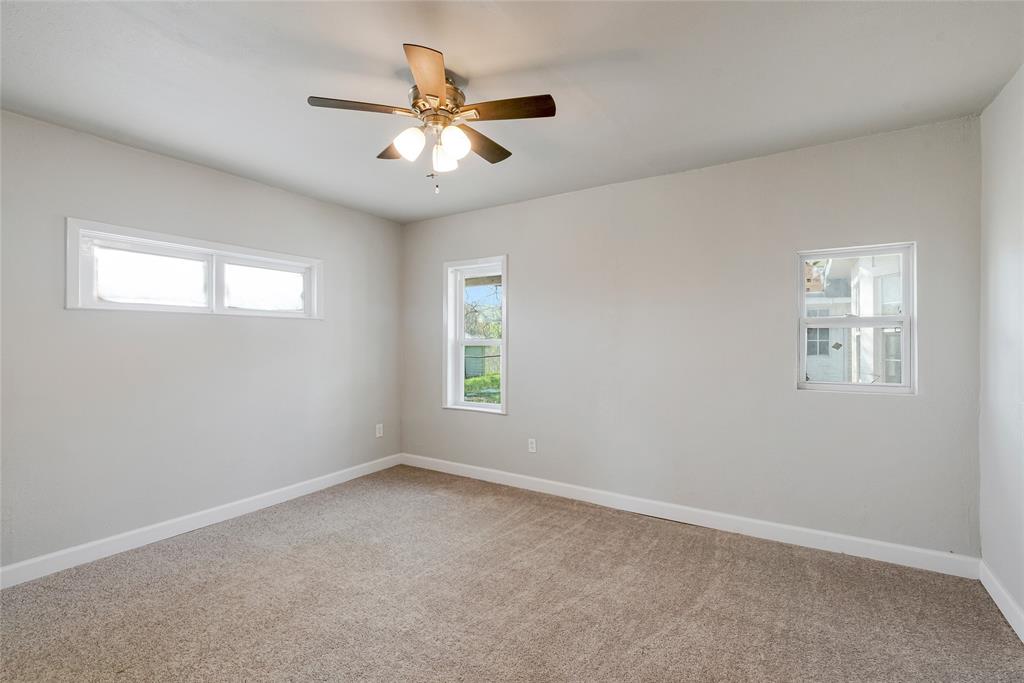 41 Kelsey Road Denison, TX 75021 - Photo 22 of 31 Large secondary bedroom with ceiling fan and new carpet.