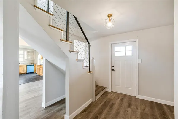 a view of livingroom with furniture and stairs