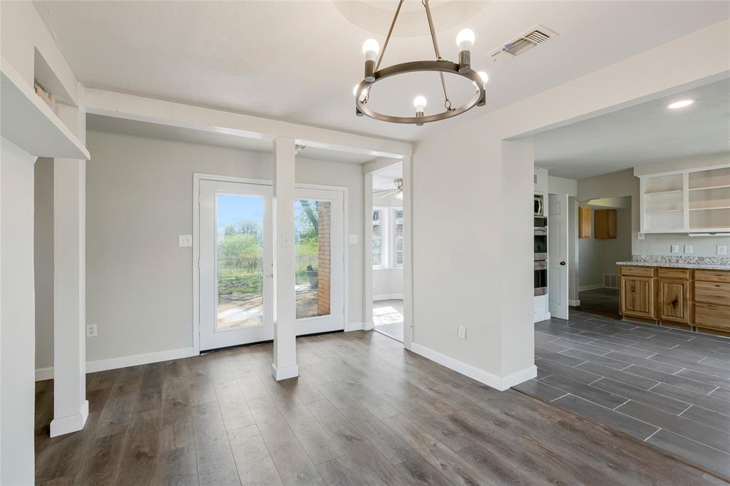 41 Kelsey Road Denison, TX 75021 - Photo 9 of 31 View of dining area leading to back patio with French doors and kitchen.