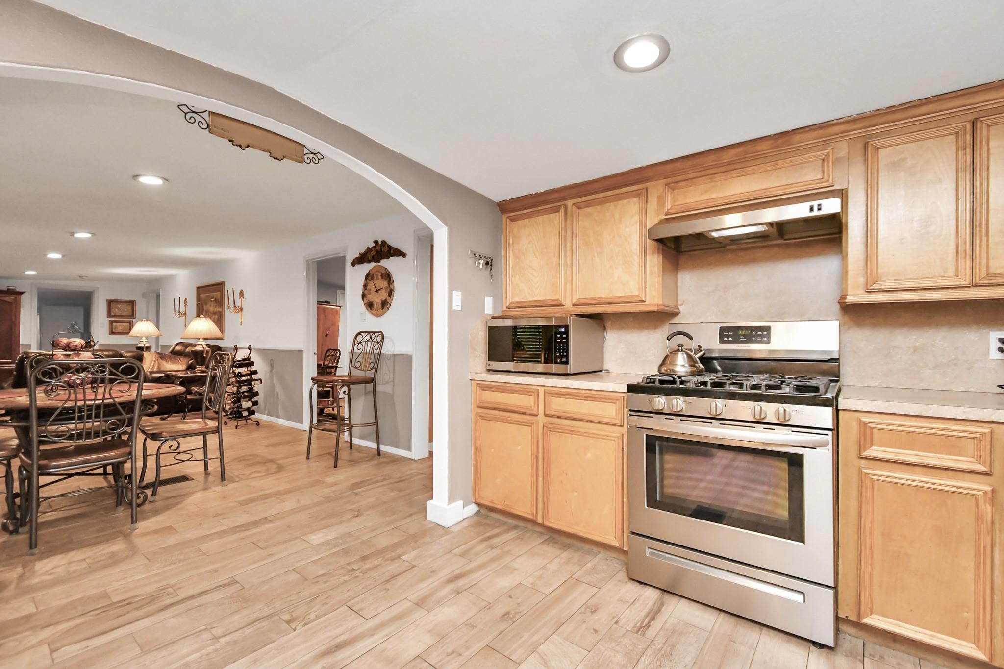 24998 Sorters Road Porter, TX 77365 - Photo 23 of 39 a kitchen with stainless steel appliances granite countertop a stove and a refrigerator