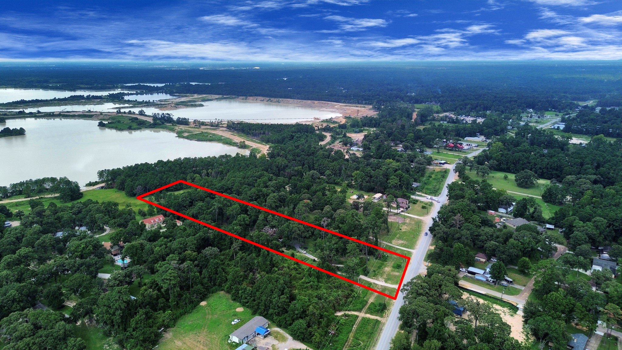24998 Sorters Road Porter, TX 77365 - Photo 8 of 39 an aerial view of residential houses with outdoor space and ocean view