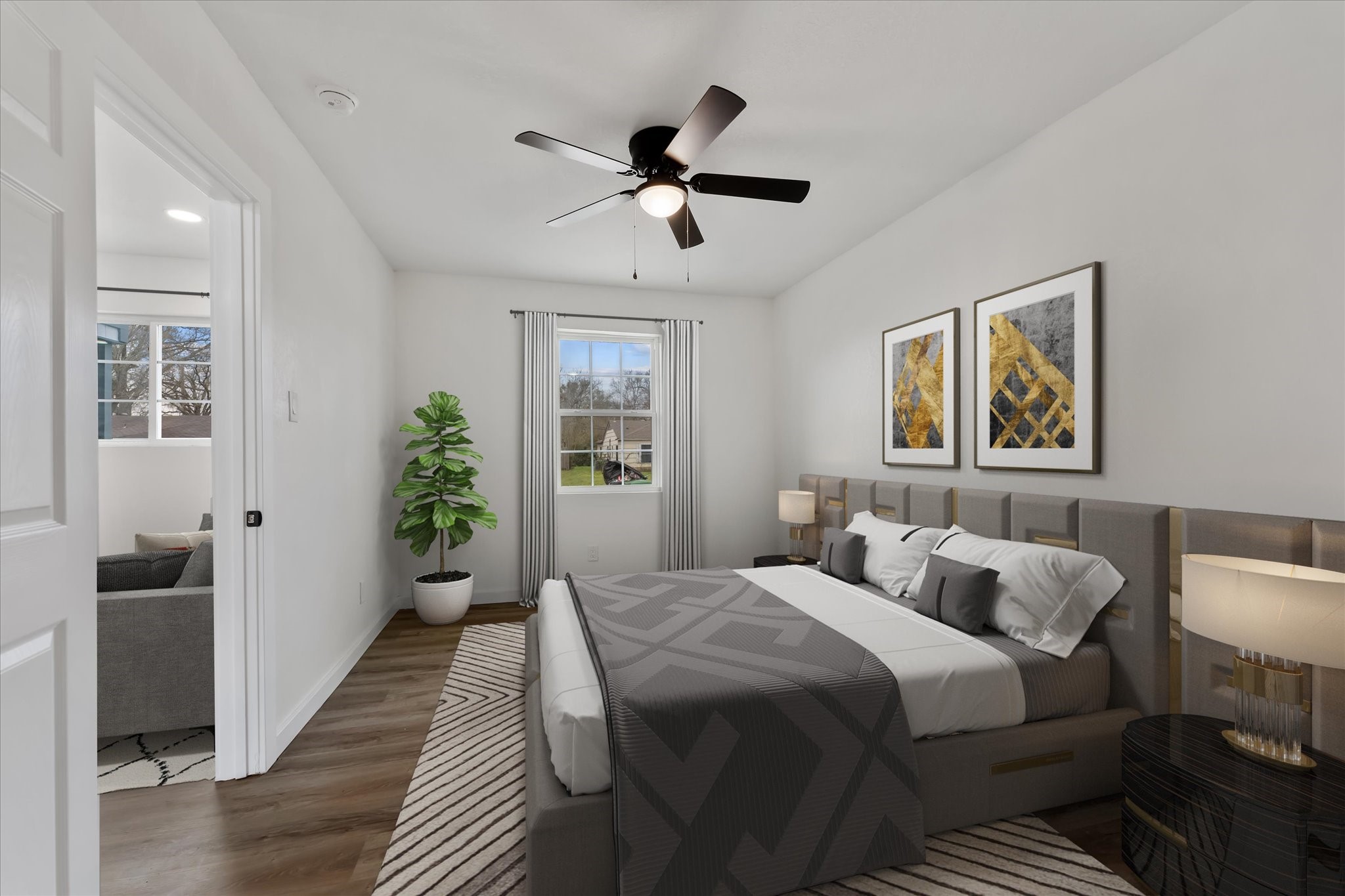 4915 Andrea Street Houston, TX 77021 - Photo 4 of 19 Virtually Staged: Unwind after a long day in this incredibly spacious Primary Bedroom! Featuring neutral painting, vinyl plank floors, a ceiling fan, and immediate access to the living room.