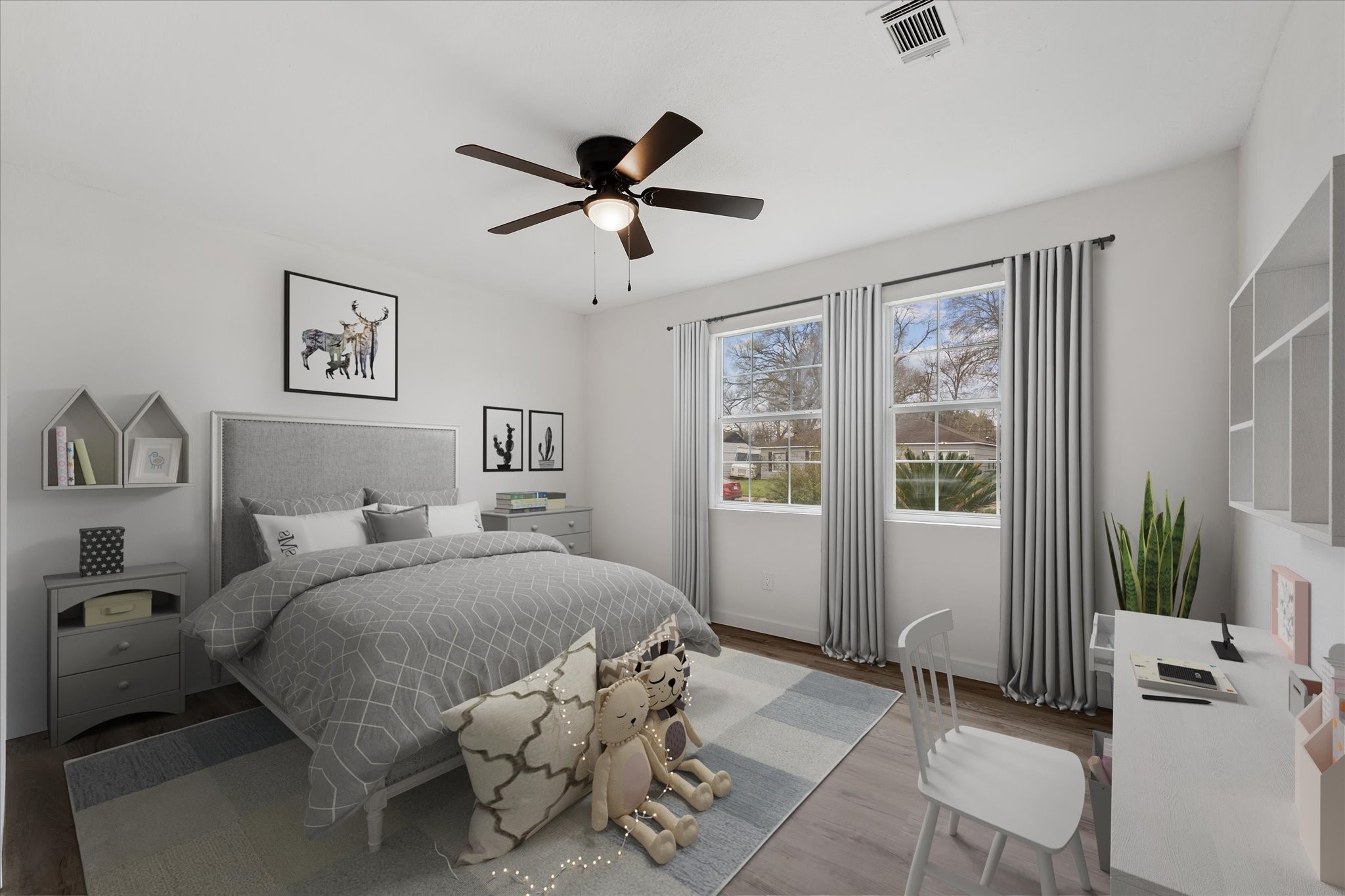 4915 Andrea Street Houston, TX 77021 - Photo 9 of 19 Virtually Staged: Large secondary bedroom, perfect for a kids room. It features neutral paint, a ceiling fan, and large windows.