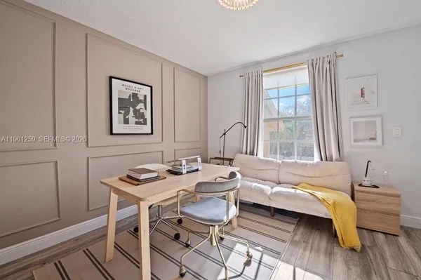 a bathroom with a sink tub shower and a mirror