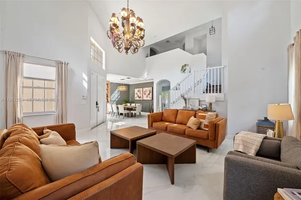 a living room with furniture and a window