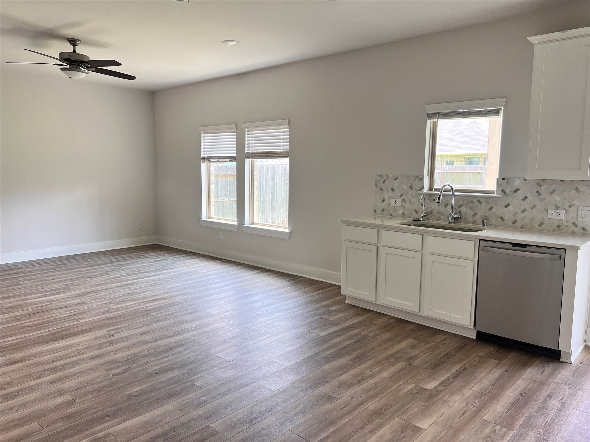 10638 Whitejacket Conroe, TX 77385 - Photo 19 of 25 a view of a kitchen with wooden floor and windows