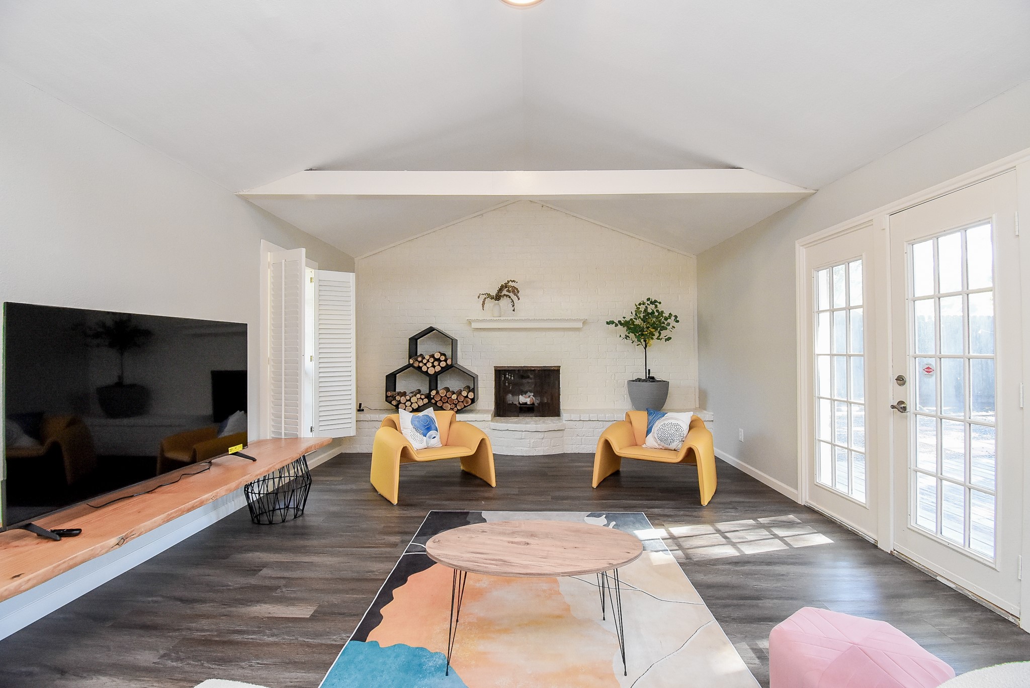 12435 Shepherds Ridge Drive Houston, TX 77077 - Photo 12 of 47 a living room with furniture a flat screen tv and a fireplace