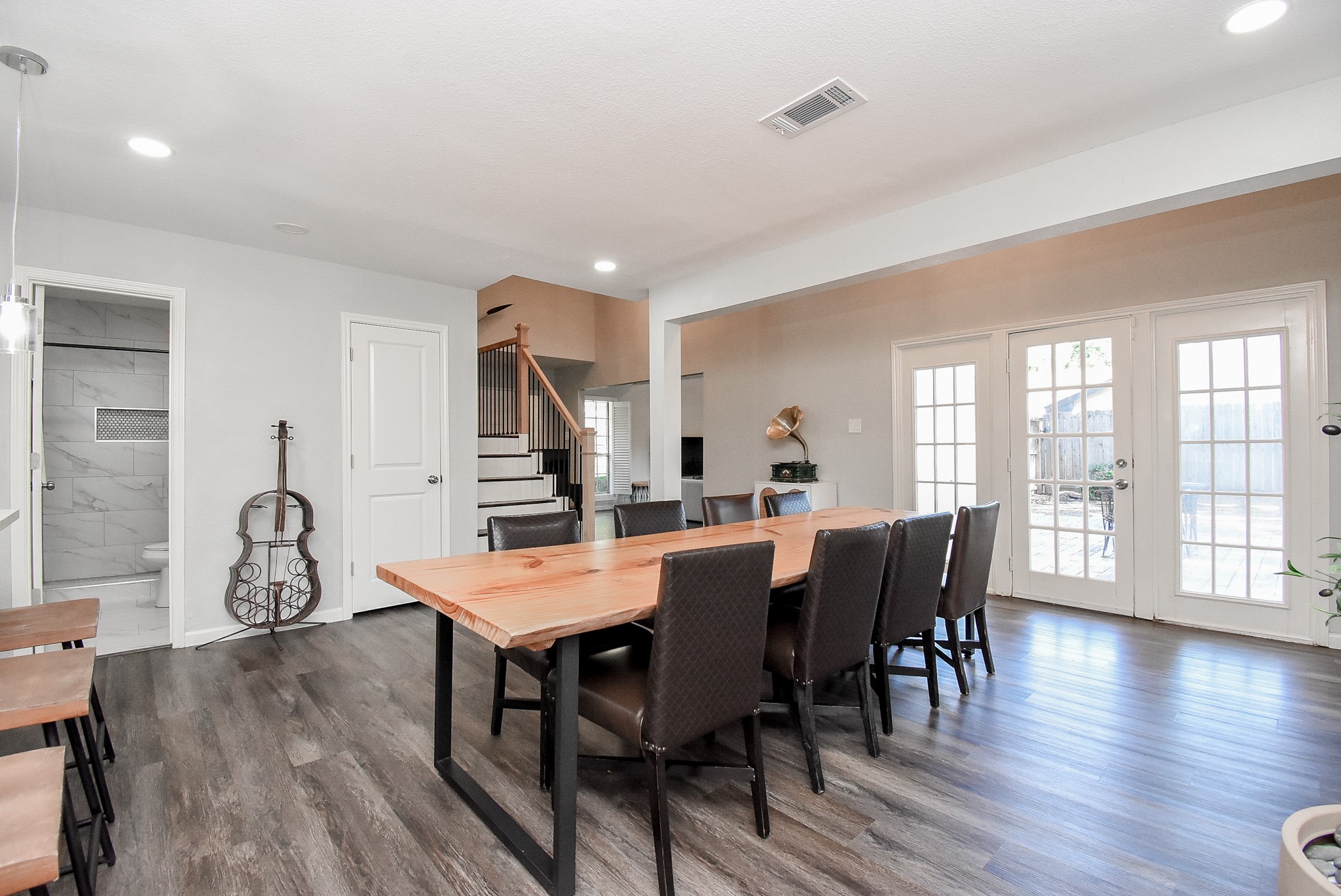 12435 Shepherds Ridge Drive Houston, TX 77077 - Photo 17 of 47 a view of a dining room with furniture and wooden floor