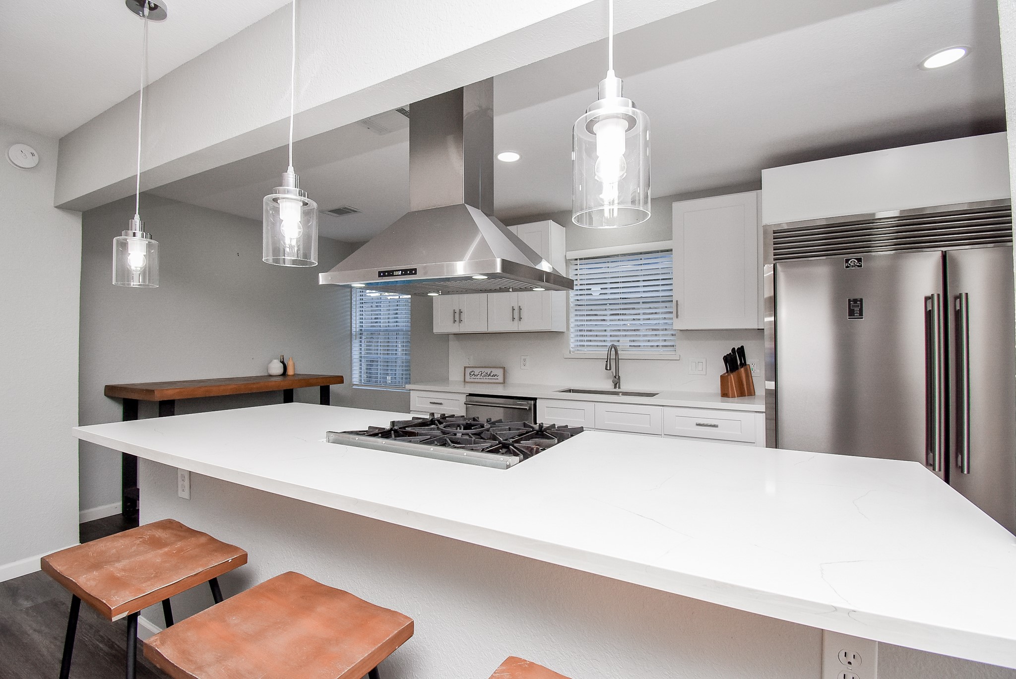 12435 Shepherds Ridge Drive Houston, TX 77077 - Photo 18 of 47 a kitchen with a stove a table and chairs in it