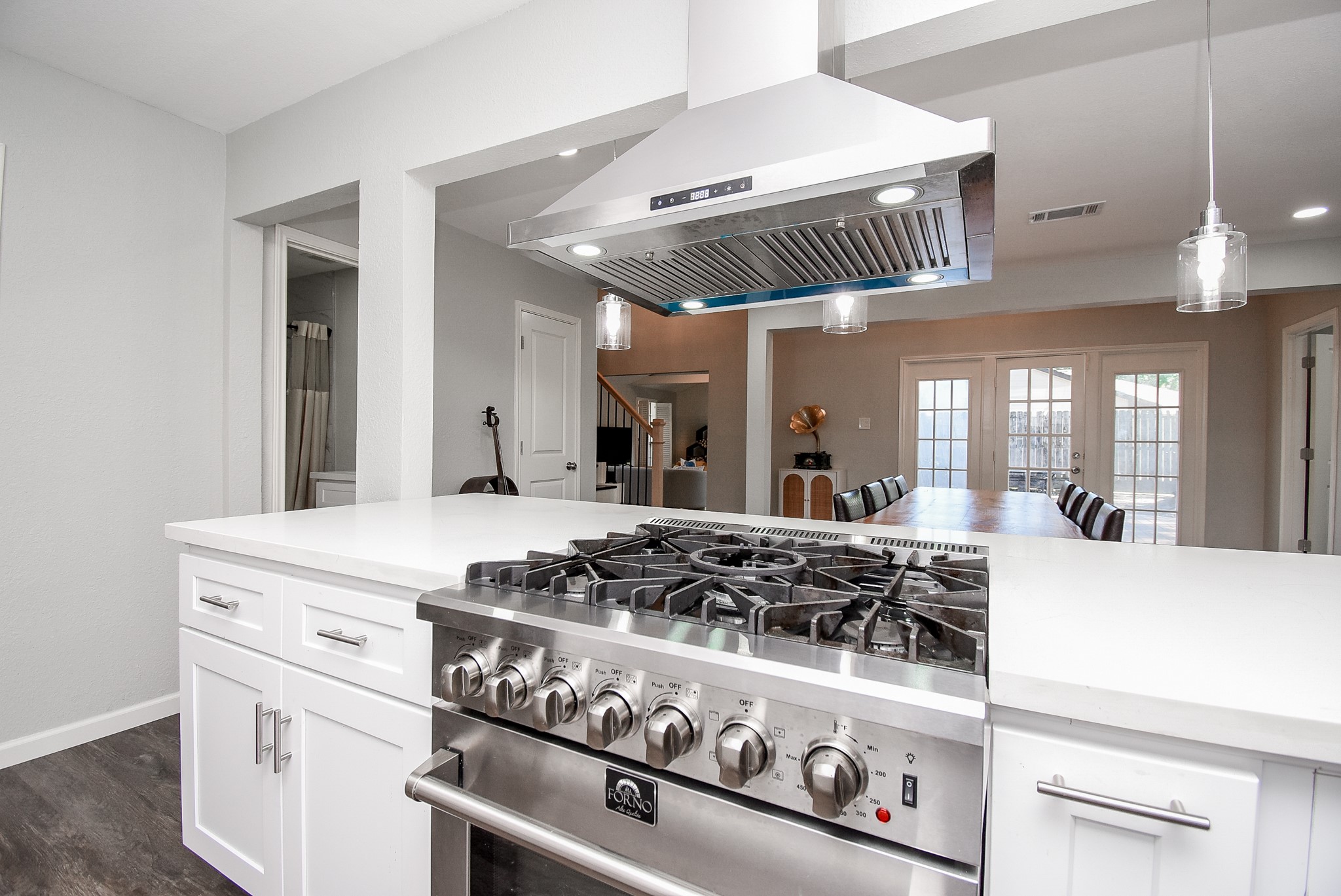 12435 Shepherds Ridge Drive Houston, TX 77077 - Photo 19 of 47 a kitchen with a stove and a white cabinets