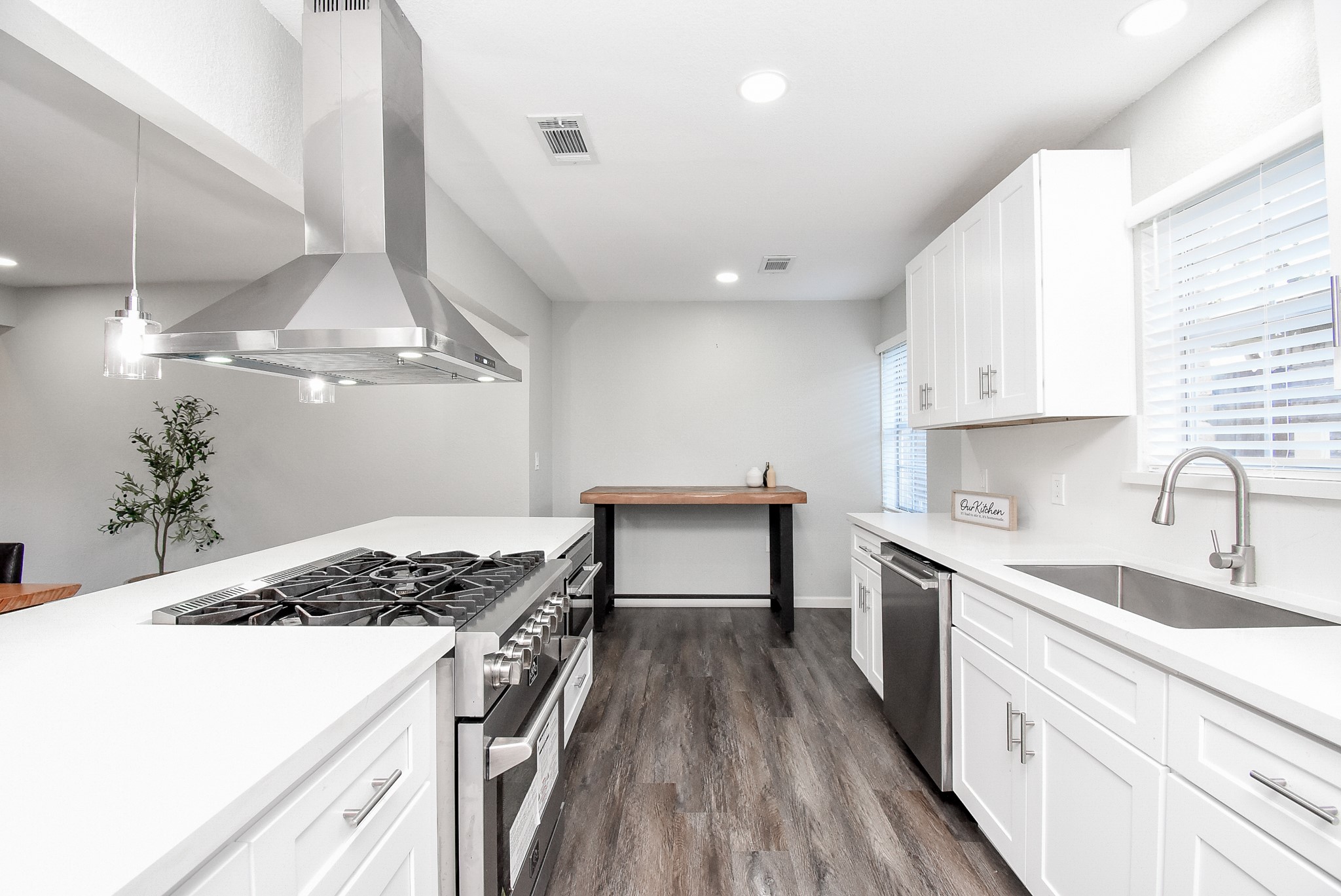 12435 Shepherds Ridge Drive Houston, TX 77077 - Photo 23 of 47 a kitchen with a stove and a sink