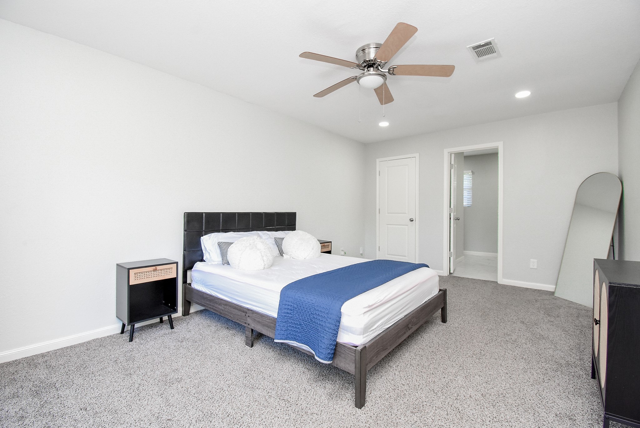 12435 Shepherds Ridge Drive Houston, TX 77077 - Photo 25 of 47 a bed sitting in a room next to a lamp