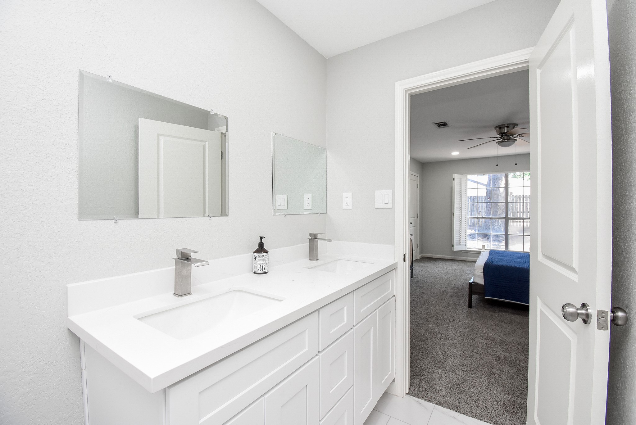 12435 Shepherds Ridge Drive Houston, TX 77077 - Photo 28 of 47 a en suite bathroom with a sink and a mirror