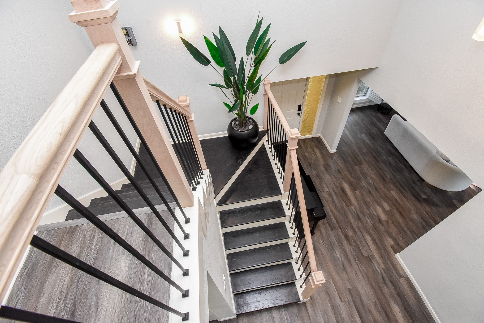 12435 Shepherds Ridge Drive Houston, TX 77077 - Photo 30 of 47 a view of staircase with wooden floor and a potted plant