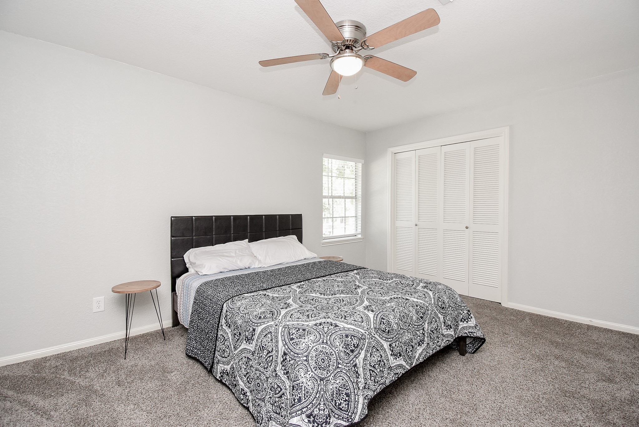 12435 Shepherds Ridge Drive Houston, TX 77077 - Photo 31 of 47 a bedroom with a bed and a chandelier