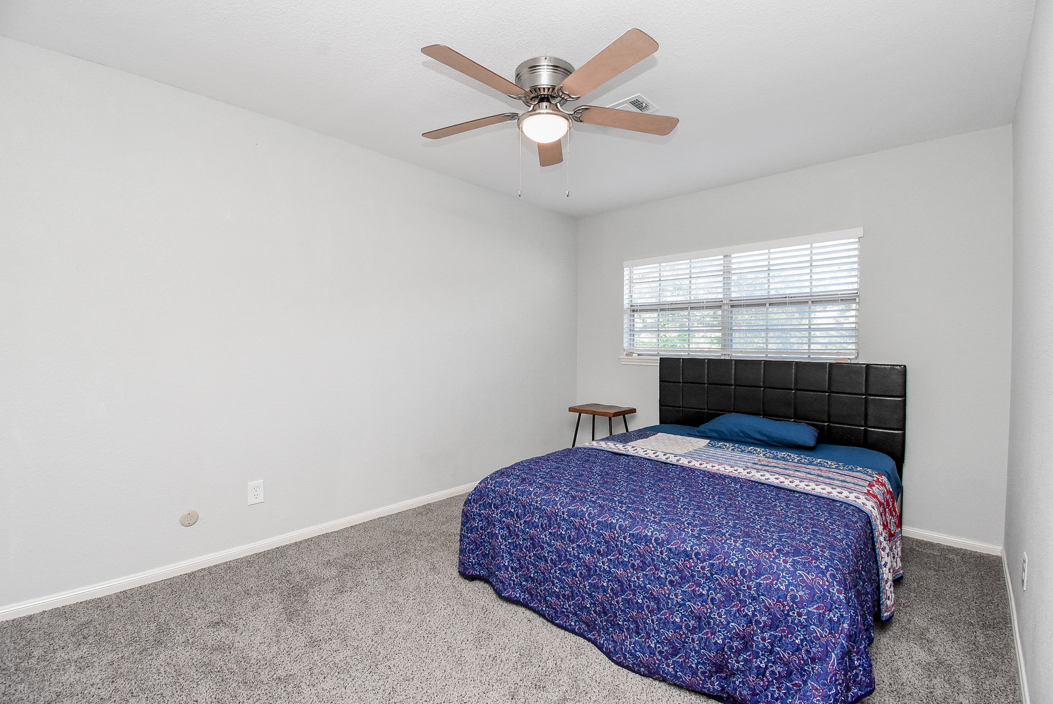 12435 Shepherds Ridge Drive Houston, TX 77077 - Photo 35 of 47 a bedroom with a bed and window