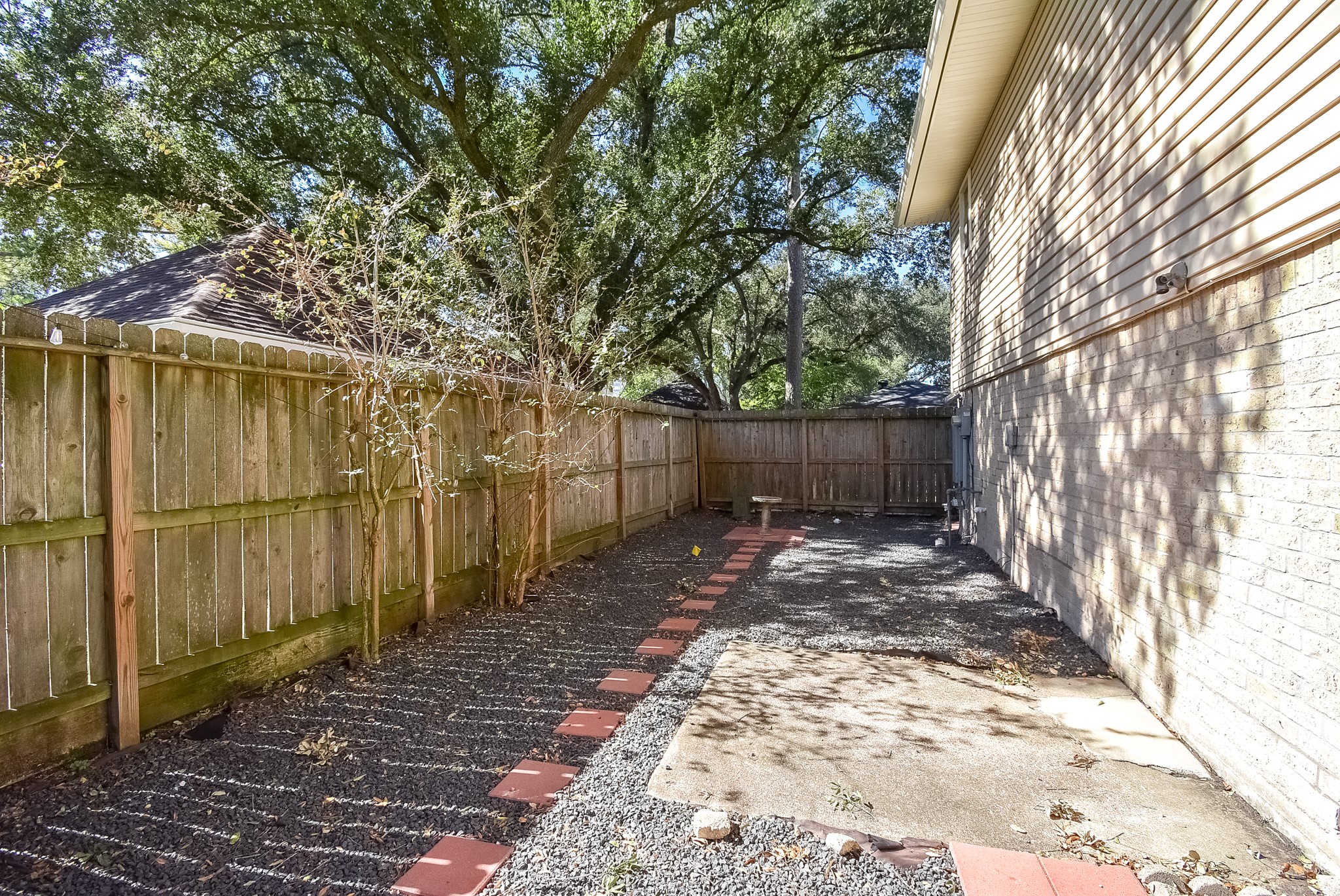12435 Shepherds Ridge Drive Houston, TX 77077 - Photo 45 of 47 a view of a backyard with large trees and wooden fence