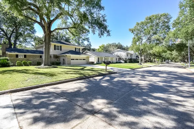 an aerial view of a house with yard