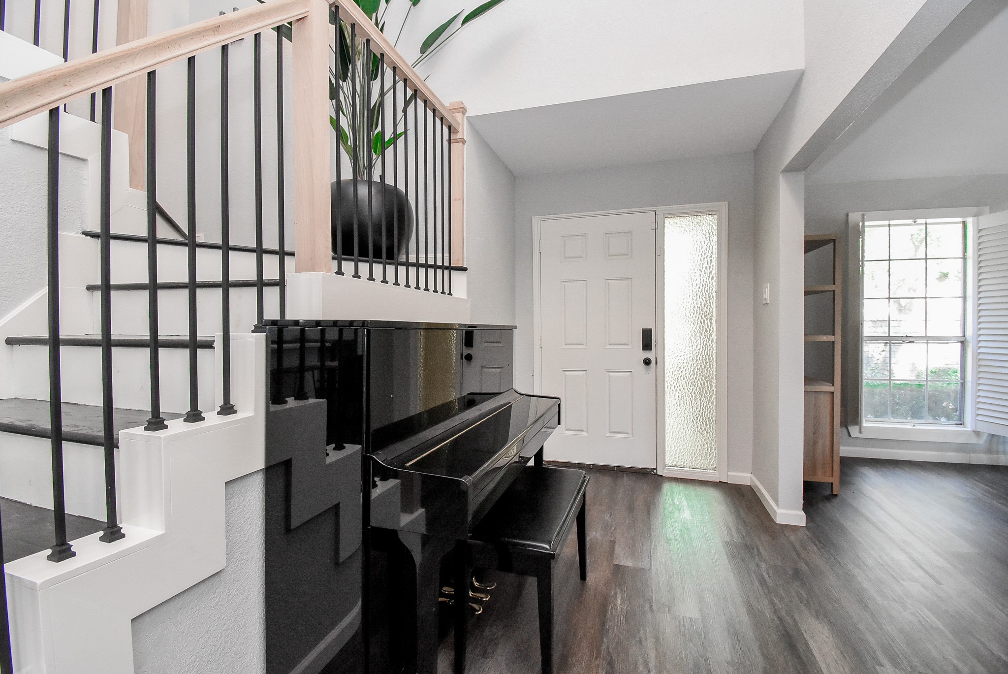 12435 Shepherds Ridge Drive Houston, TX 77077 - Photo 9 of 47 a view of a hallway with wooden floor and staircase