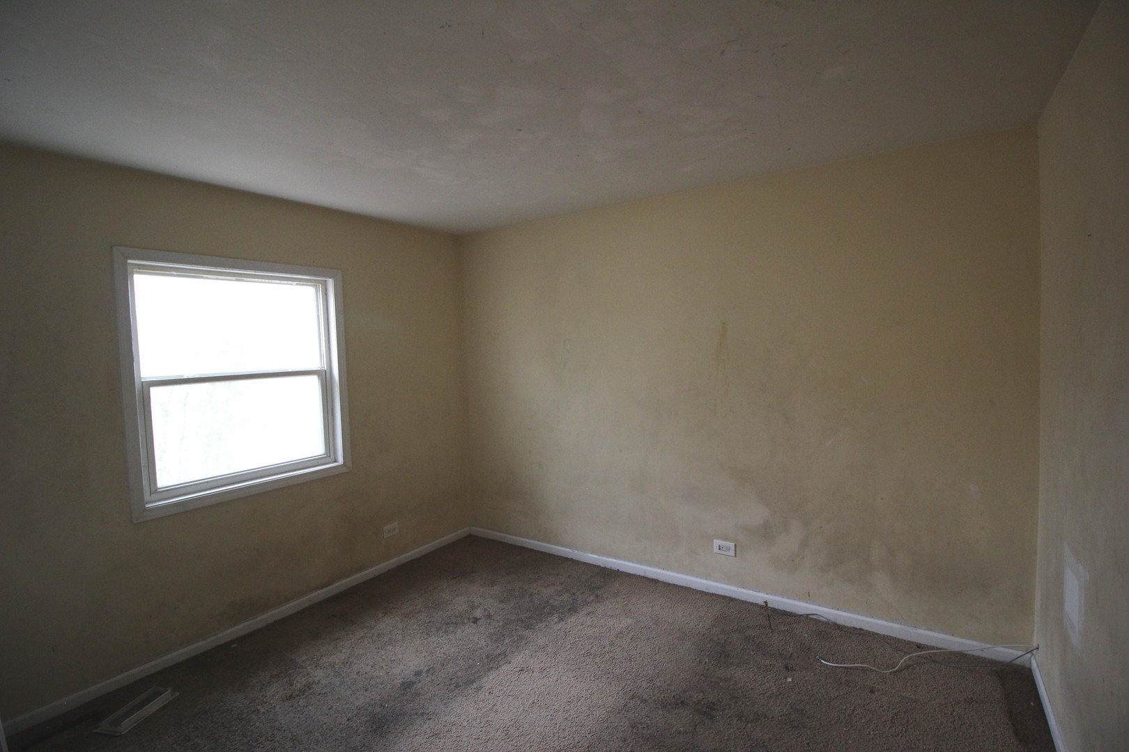 1723 McKool Avenue Streamwood, IL 60107 - Photo 11 of 11 an empty room with a window