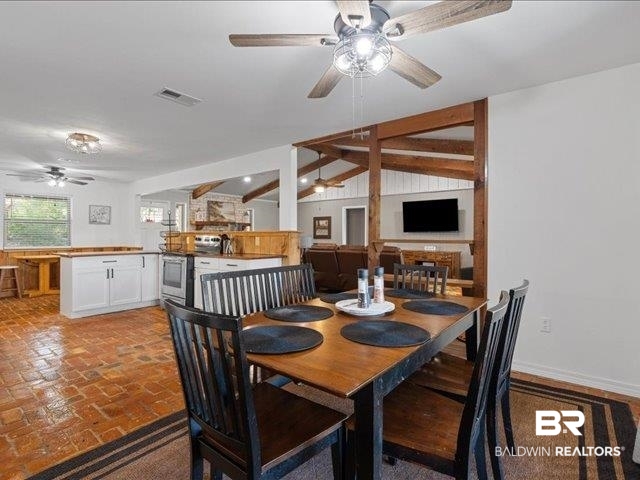 4650 Wiggins Lane Wilmer, AL 36587 - Photo 9 of 66 Dining space with a ceiling fan and brick floors