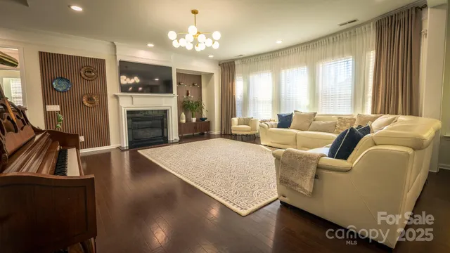 a spacious bedroom with a bed and a large window