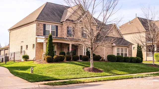 a view of a white house with a yard
