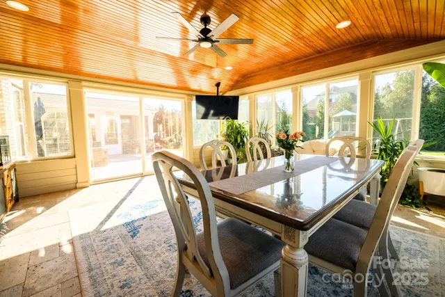 a bathroom with a granite countertop sink a large mirror and a shower