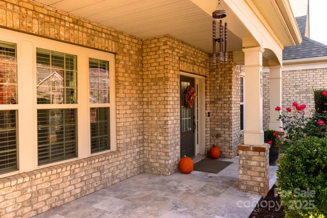a front view of a house with outdoor seating
