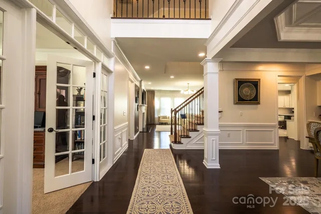 a living room with furniture fireplace and dining room