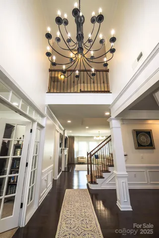 a room with a book shelf and a bath tub