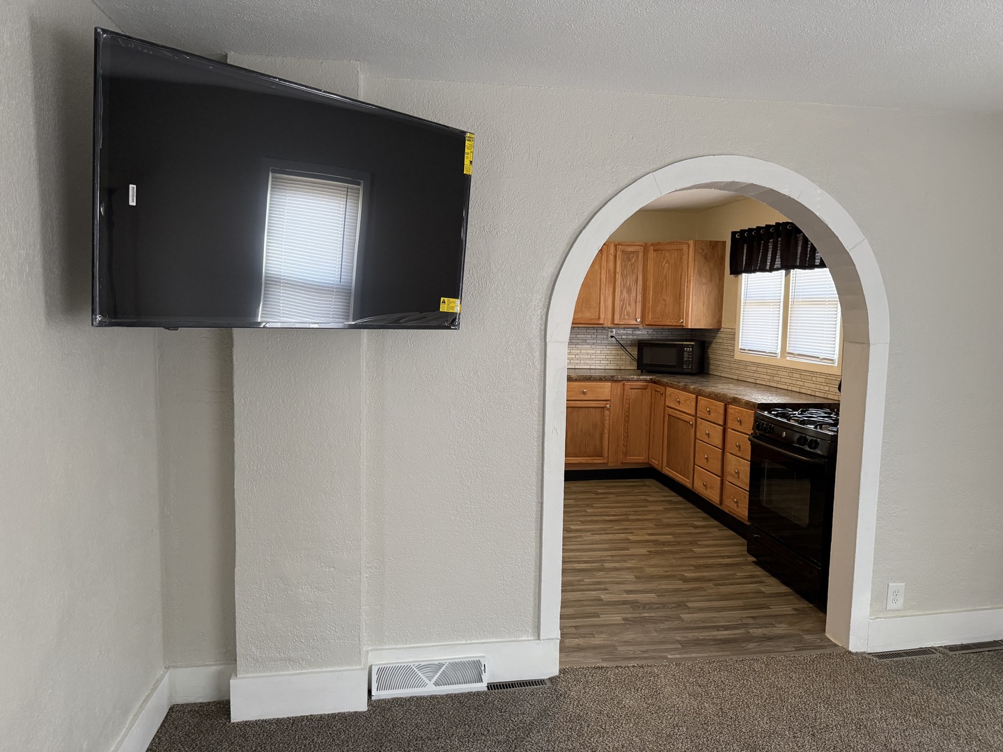 513 Barney Riva Street Dalzell, IL 61320 - Photo 6 of 39 a kitchen with stainless steel appliances granite countertop a stove a sink and a microwave