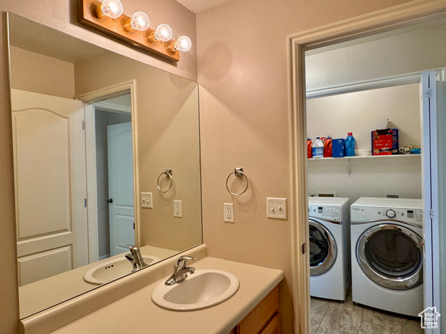 445 Topaz Boulevard, Unit 10 Delta, UT 84624 - Photo 18 of 28 Bathroom featuring separate washer and dryer and vanity