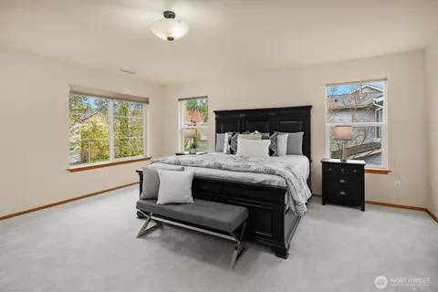 a bedroom with a bed and a couch