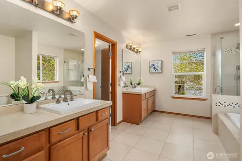 a bathroom with a bathtub and a window