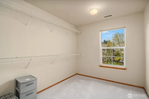 a bedroom with bed and window