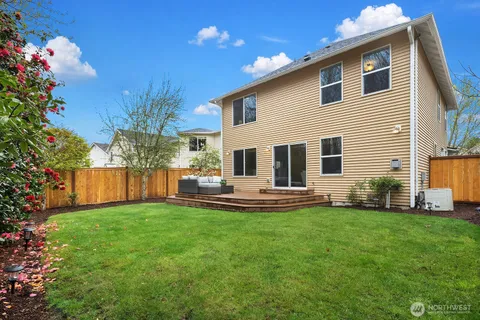 a view of a couches in the deck with a backyard