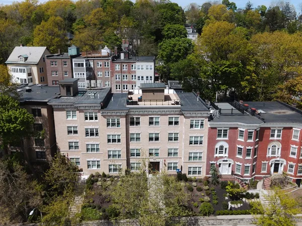 a view of a building with windows and garden