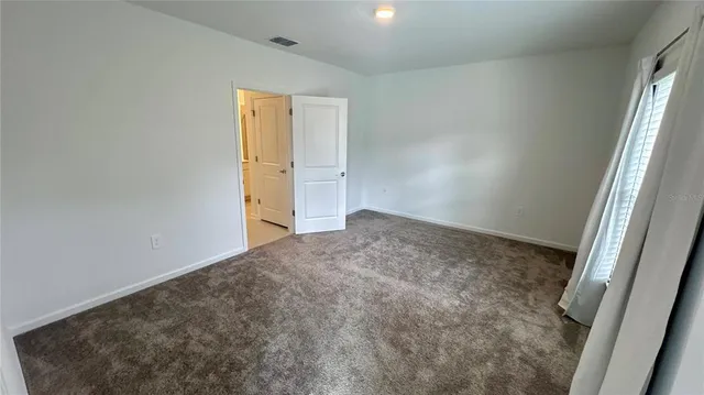 an empty room with a hallway
