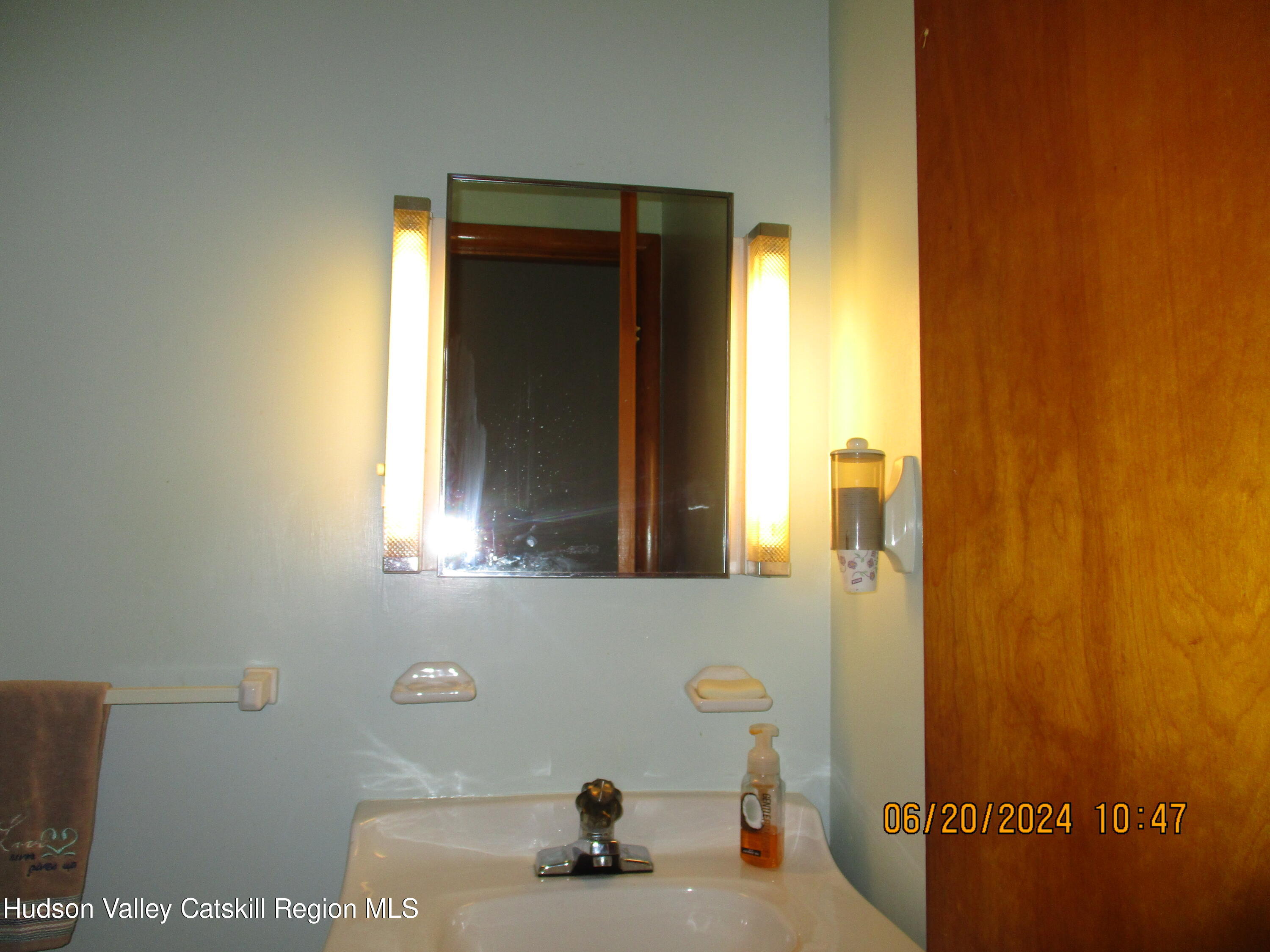 611 Plainfield Street Kingston, NY 12401 - Photo 14 of 27 a bathroom with a sink and a mirror