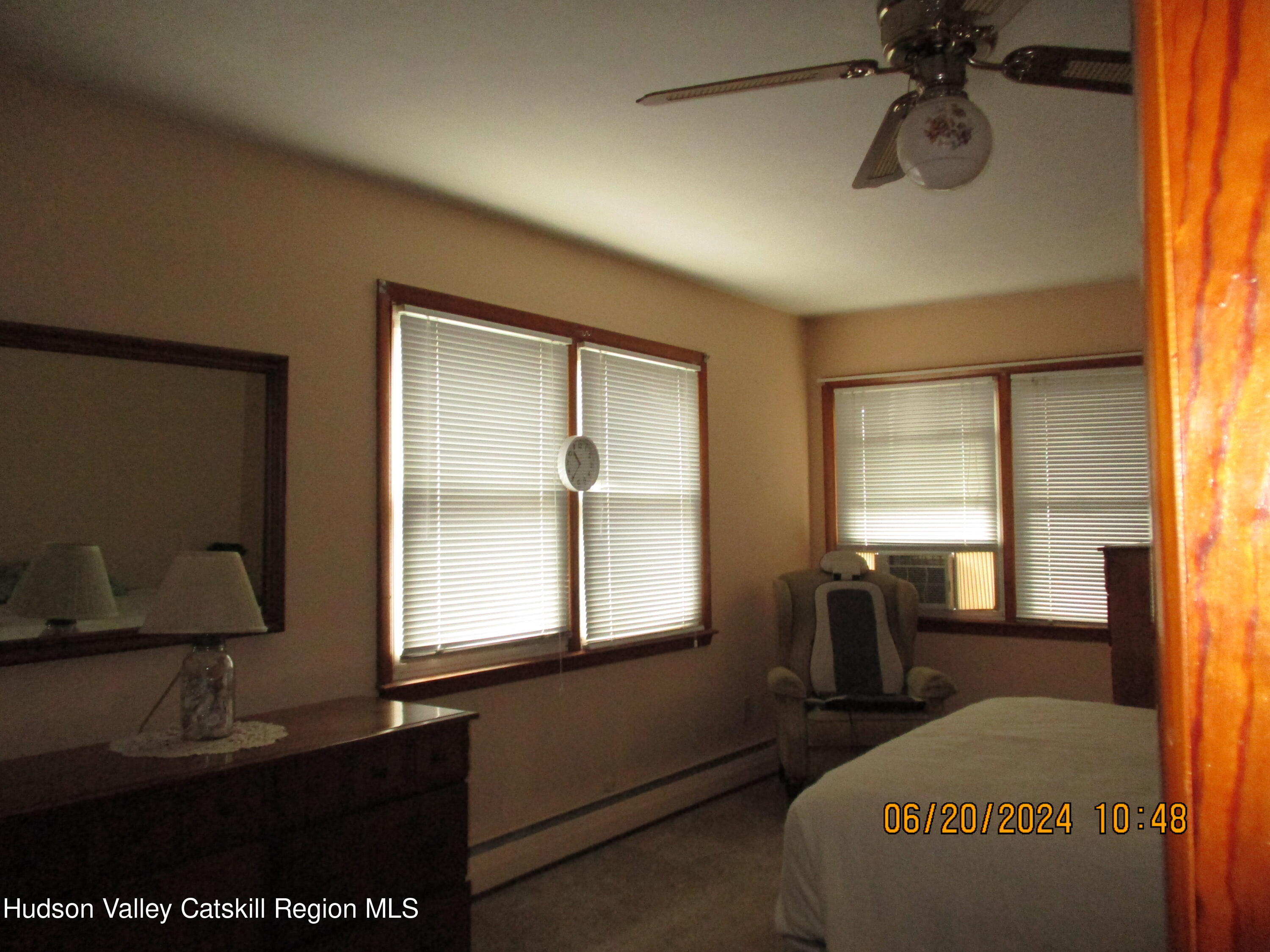 611 Plainfield Street Kingston, NY 12401 - Photo 17 of 27 a bedroom with a bed and wooden floor