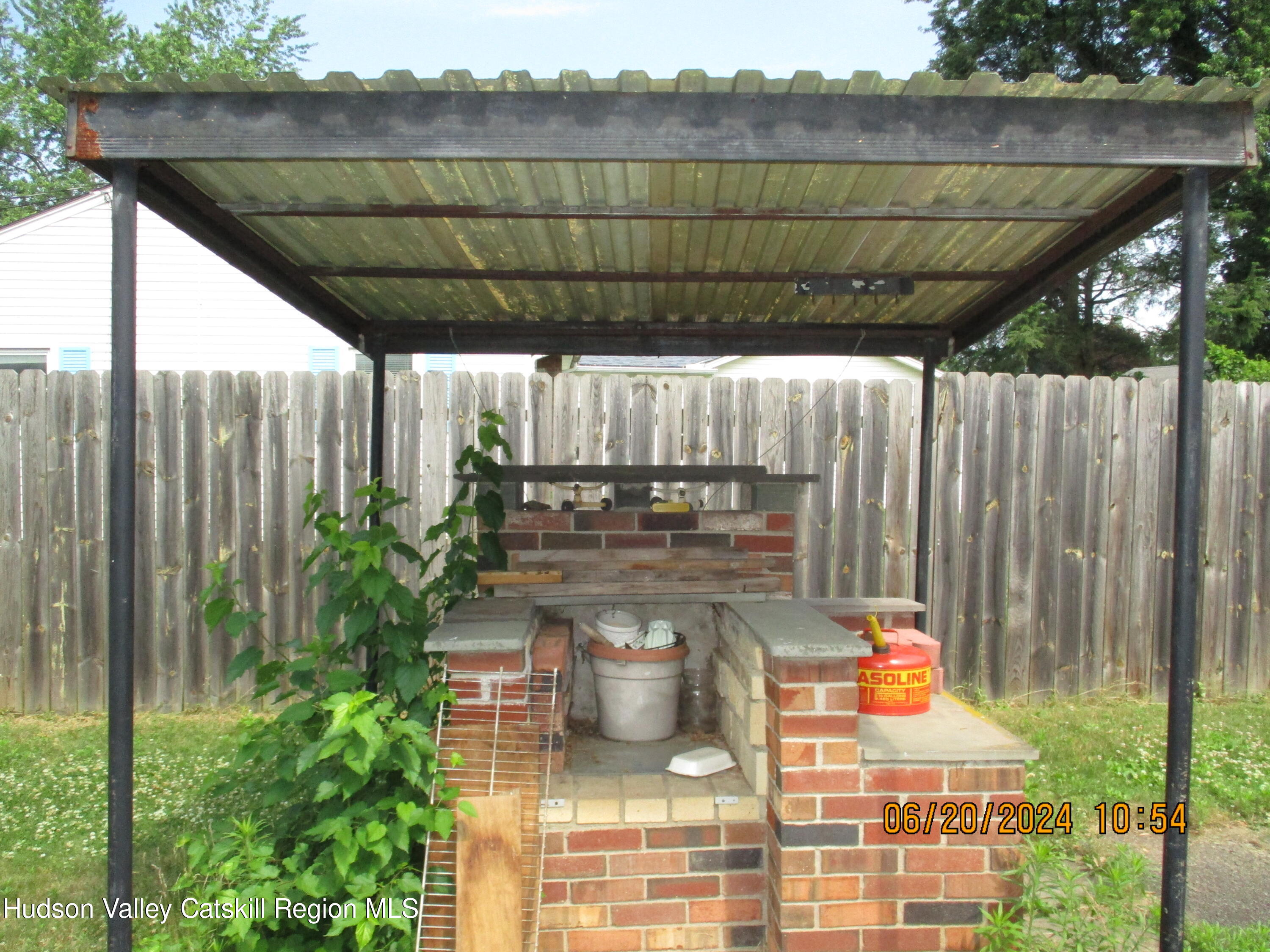 611 Plainfield Street Kingston, NY 12401 - Photo 25 of 27 a view of a patio with table and chairs and potted plants