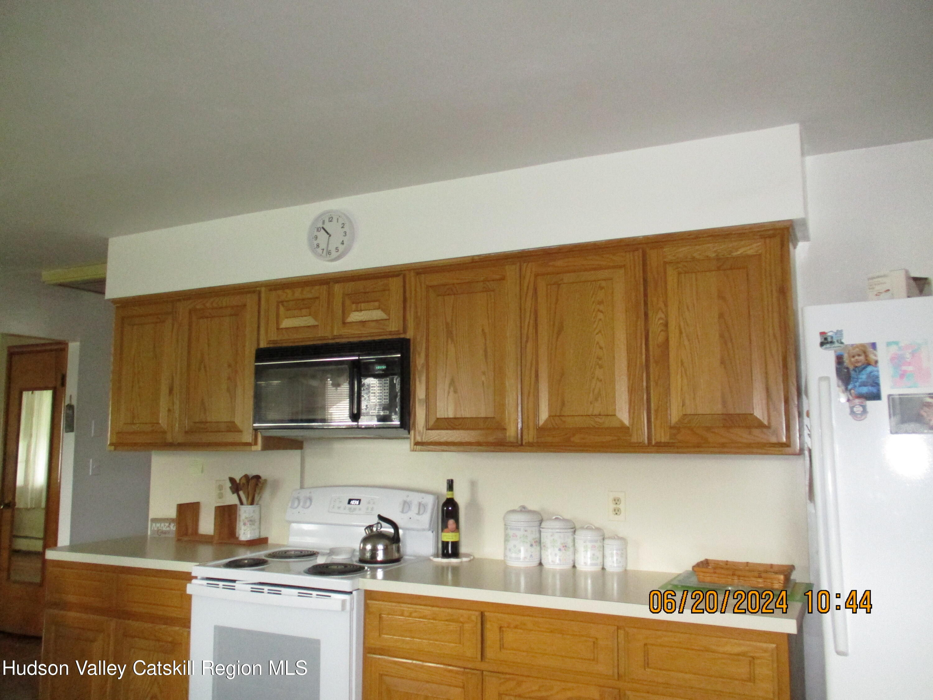611 Plainfield Street Kingston, NY 12401 - Photo 7 of 27 a kitchen with stainless steel appliances granite countertop a refrigerator and sink
