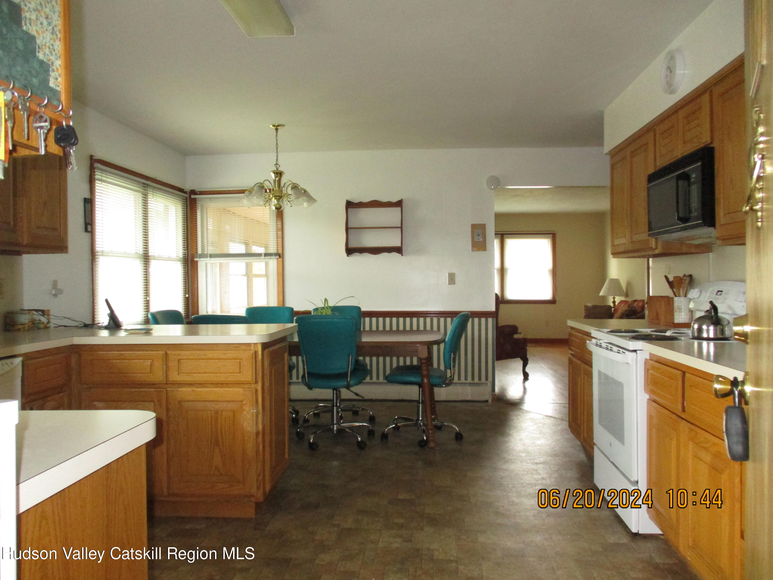 611 Plainfield Street Kingston, NY 12401 - Photo 8 of 27 a kitchen with sink cabinets and dining table