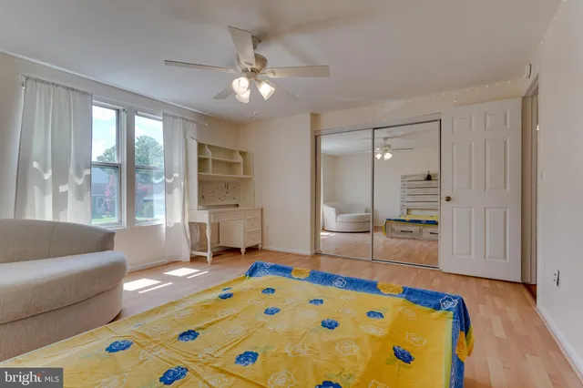 a bedroom with a bed and a couch