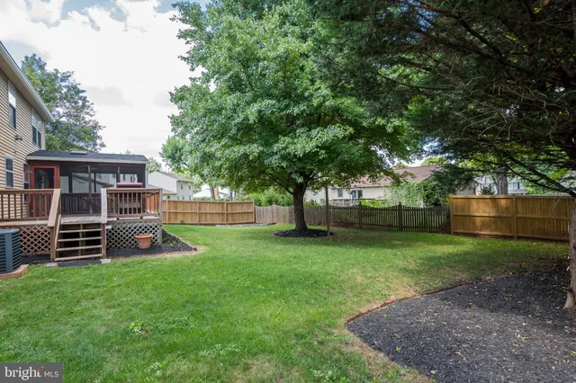 a view of a house with a yard porch and sitting area